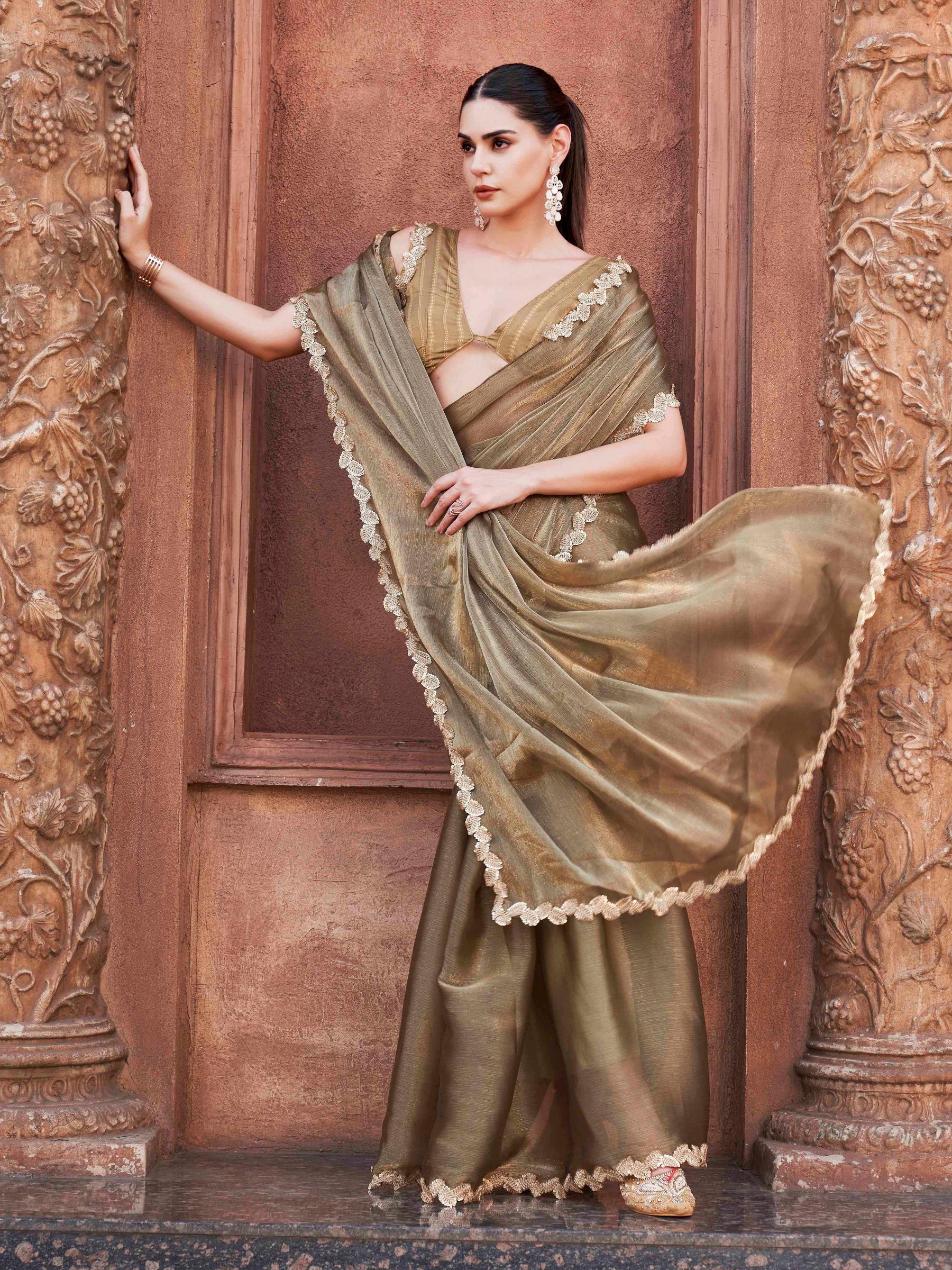 Two toned olive green and gold colored jimmy choo saree with brocade blouse and embroidered lace